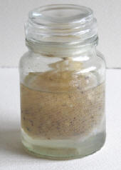 Damar disolving in a glass jar